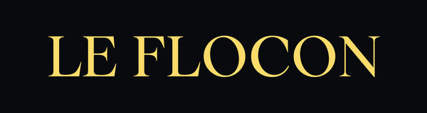 Goldenes Le Flocon Logo, elegantes Markenzeichen der Luxus-Parfums The Angel und The Devil.